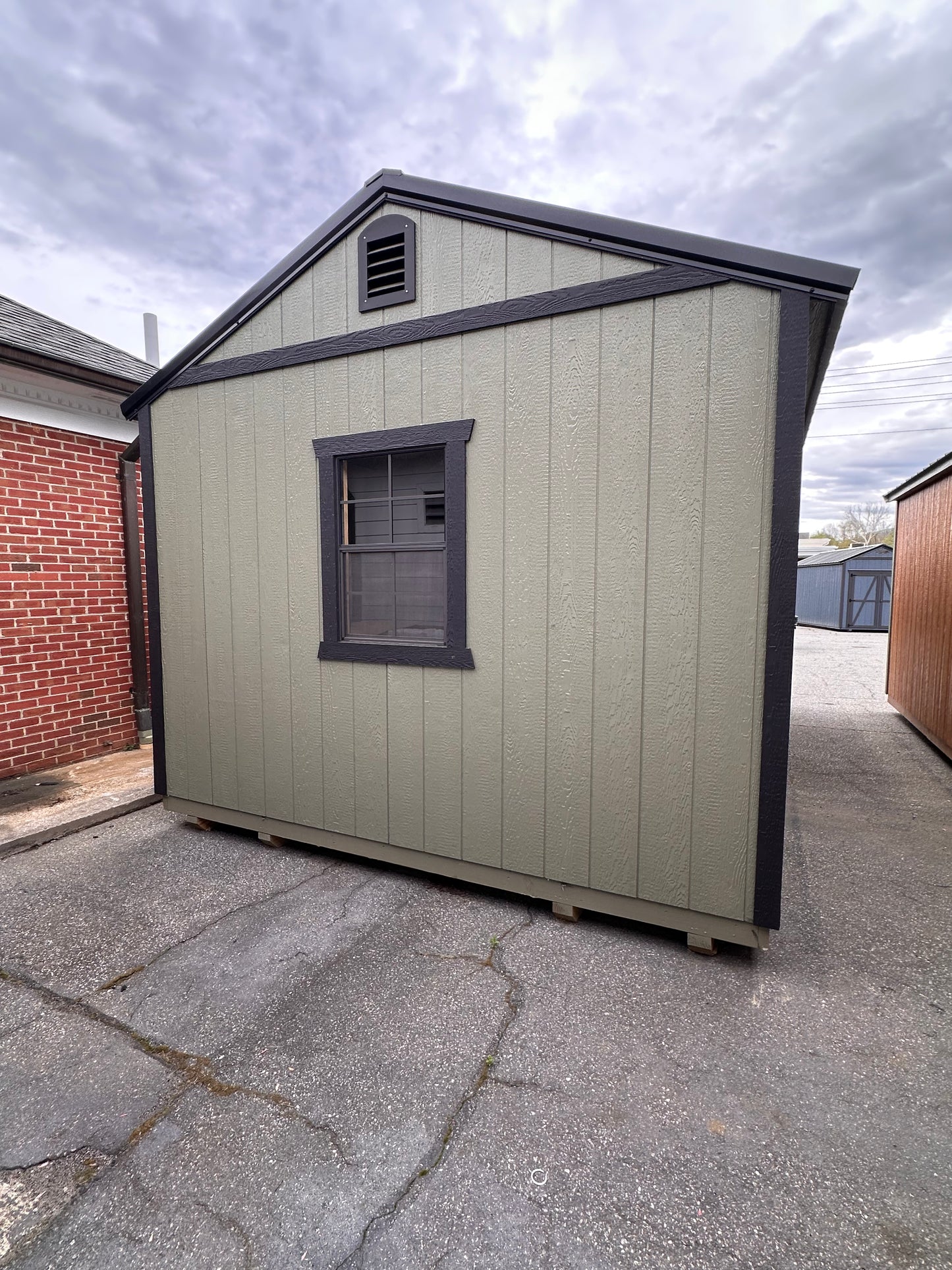 12x20 Shed with 8x7 Roll-Up Garage Door – Solid Fiberglass Entry Door, Window, & Electric Packagec